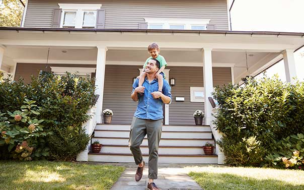 father and son in front yard 